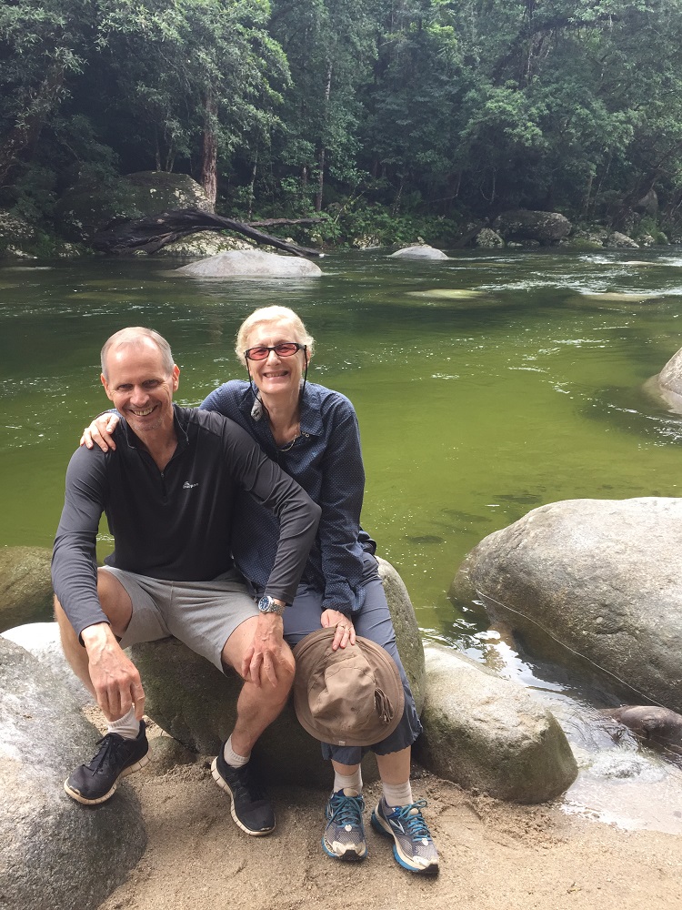 Ric and Gill with the icy cold fast flowing waters of Mossman Gorge behind them.
