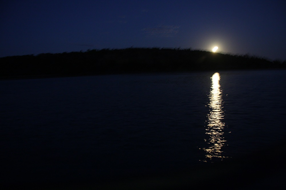 Magical evening anchored in calm water in Plantation Bay, Lindeman Island with a huge full moon rising.