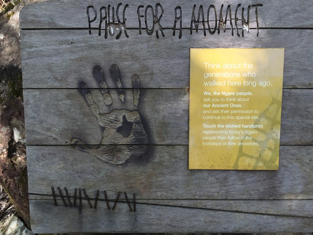 In aboriginal culture it is common to ask their ancestors for permission before entering certain sites. This sign asks the visitor to pause and think about the people who walked here before them and acknowledge the Ancient Ones by putting your hand over the handprint.