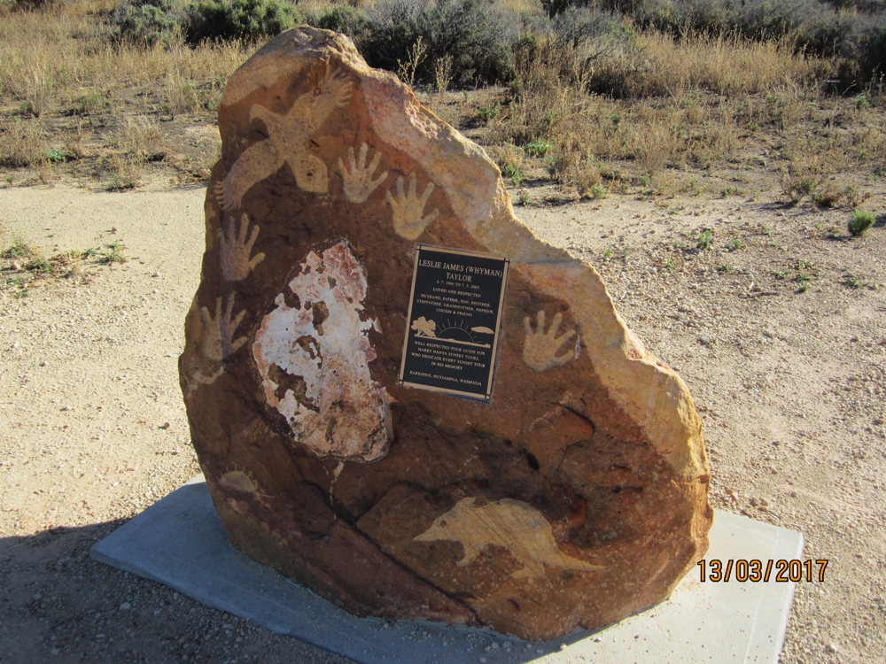 A memorial to an indigenous ranger who died on the job. The numbat at the bottom and the eagle at the top are totems of his family.