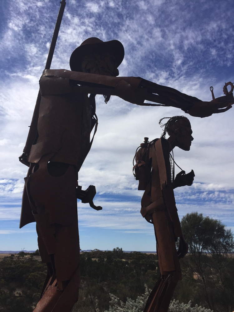Eyre and Wylie sculptures on top of White Knob, Kimba. Note Eyre is holding his compass.