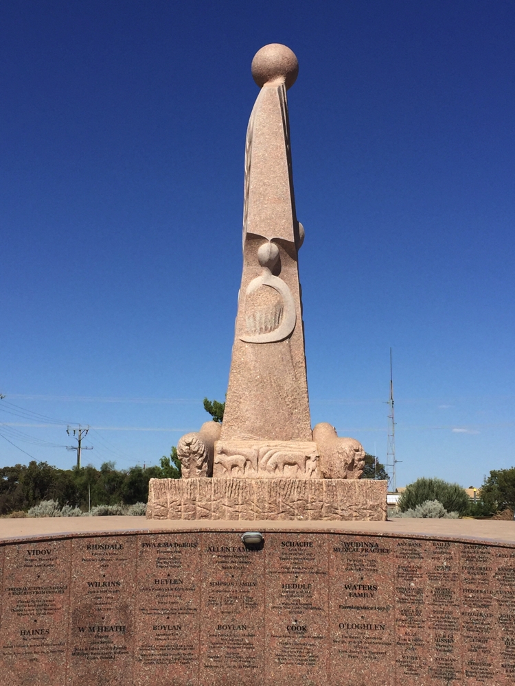 Another side of the Australian Farmer monument. The stylised human is formed from a sickle, and the lambs signify growth.