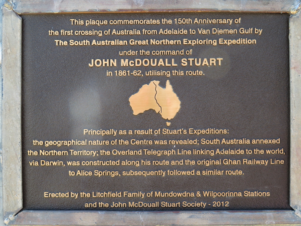 Stuart's contribution to opening up central Australia is commemorated. His expeditions permitted not only communication from south to north, but also settlements and farming.