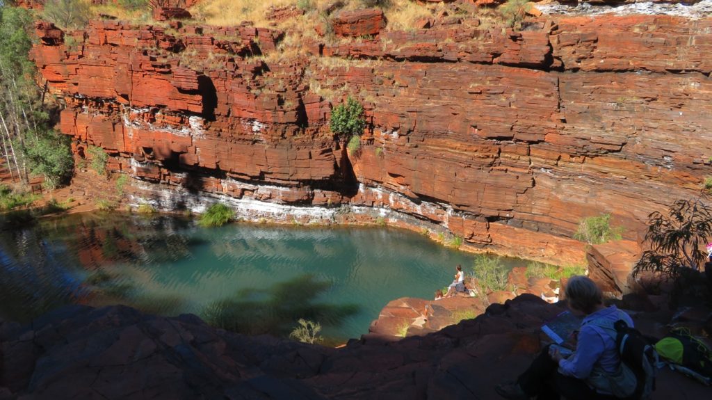 Relaxing on the naturally formed slab seating around Fortescue pool. Dales Gorge.